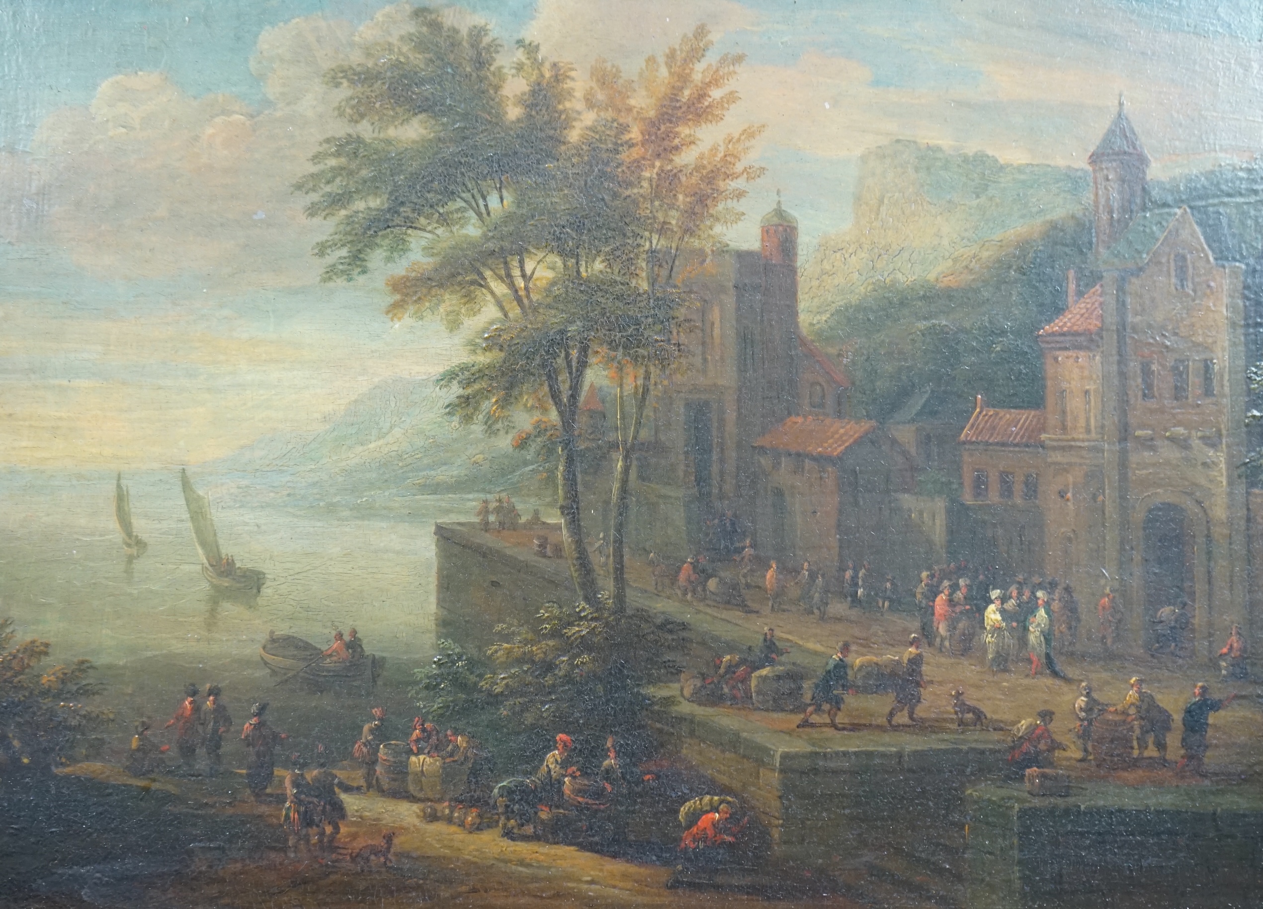 Pieter Bout (Brussels 1658-1702) and Adriaen Frans Boudewijns (Brussels 1644-1711), A coastal port with figures moving cargo and, A fortified town with revellers beyond the walls, oil on panel, a pair, 23 x 32cm